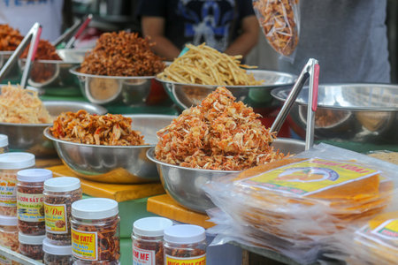 Nha Trang City, Vietnam - 01 May 2023: Closeup of deep fried fish and baby crab - Traditional vietnamese cuisine in Dam market, Nha Trang city, Khanh Hoaのeditorial素材