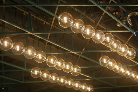 The ceiling is decorated with yellow circle light bulbs in a modern style in Shopping Center