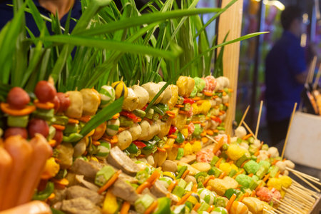 Sausage, meatballs, dumplings, fish balls, squid ready for fried, Have a variety of meatballs beautifully displayed for sale in Vietnamese kios shopの写真素材