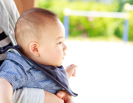 Profile of a baby in the parkの写真素材