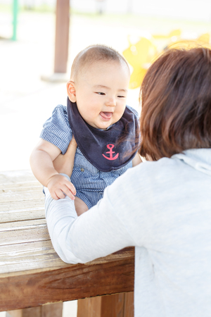 mother and baby in the parkの写真素材