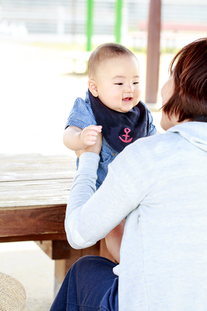 mother and baby in the parkの写真素材
