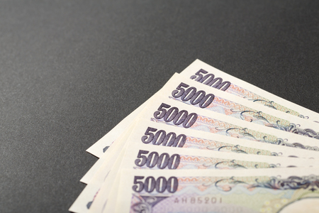 Japanese bank note 5000 yen on black backgroundの写真素材