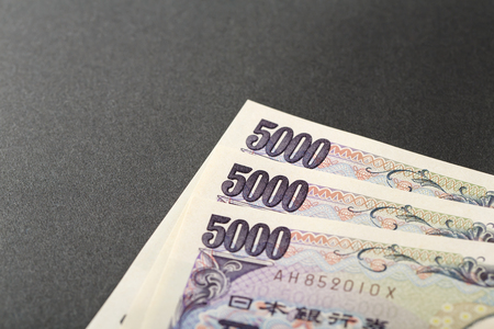Japanese bank note 5000 yen on black backgroundの写真素材