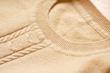 Beautiful, luxurious, knitted sweater in beige, autumn, winter, warm.の写真素材