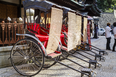 Good-looking Japanese rickshaw or jinrikisha with bamboo blind in dogo onsen.の写真素材