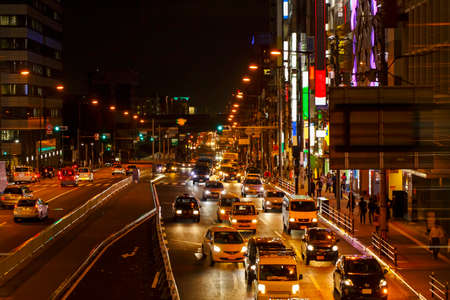Lights of car traffic on a busy City road at night in the big city.の写真素材