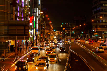 Lights of car traffic on a busy City road at night in the big city.の写真素材