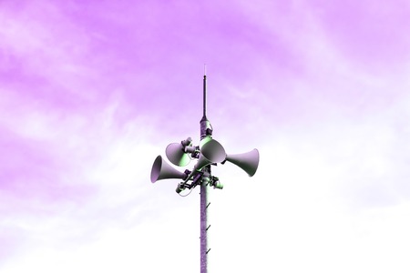 Loudspeaker to be used for the announcement of the event of a disaster.loudspeaker of disaster-forecast with pink, purple sky.の写真素材