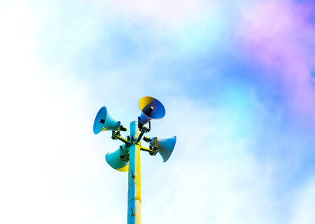 Loudspeaker to be used for the announcement of the event of a disaster.loudspeaker of disaster-forecast with pink, purple, dark blue sky.の写真素材