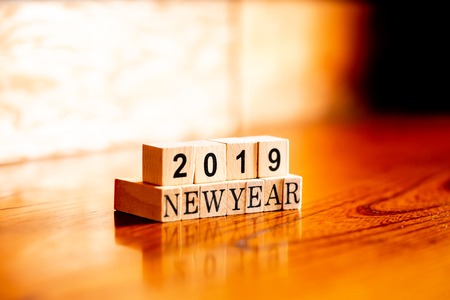 2019 with new year - isolated abstract in wood type blocks against wooden background and copy space.close up.の写真素材