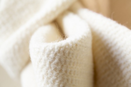 CloseClose-up of the white ribbon of thick material.coat or jacket.-up of the white ribbon of thick...