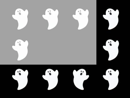 Set of white ghosts isolated on black and gray color background. Halloween ornament is colorful Tones.Flat lay.copy space for your text.の写真素材