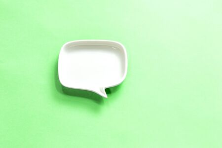 white Blank dialog speech bubble of the dish Isolated on green Background.