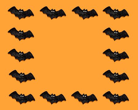 Set of black bats isolated on orange color background. Halloween ornament is colorful Tones.Flat lay.copy space for your text.の写真素材
