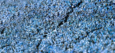 Dried cracked or rich earth soil ground texture background. crack pattern of sunny rich earth soil and copy space and blue.の写真素材