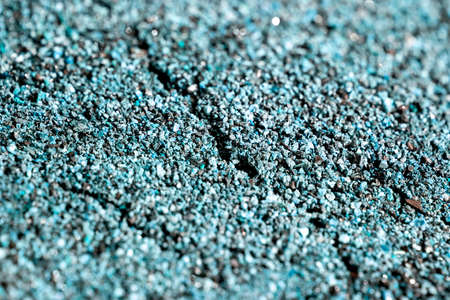 Dried cracked or rich earth soil ground texture background. crack pattern of sunny rich earth soil and copy space and blue.の写真素材