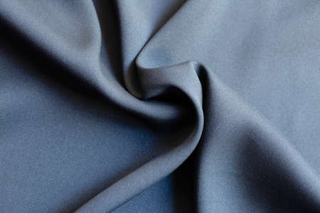 Background texture of black pattern fabric made of cotton or silk close up.の写真素材