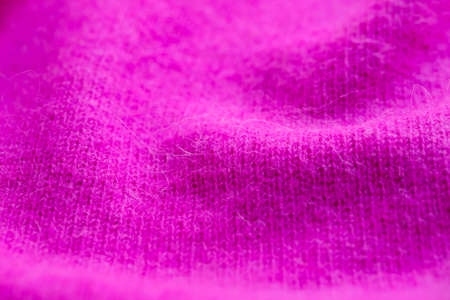Background texture of pink pattern knitted fabric made of angora or wool. close up.の写真素材