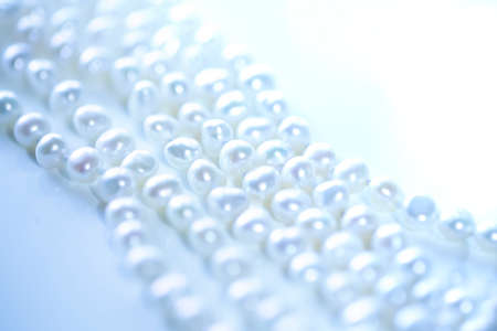 the pearl on a blue background and copy space. close up.の写真素材