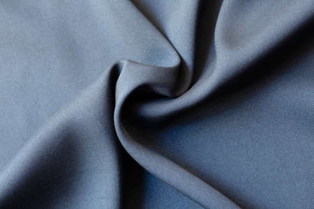Background texture of black pattern fabric made of cotton or silk close up.の写真素材