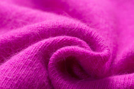 Background texture of pink purple pattern knitted fabric made of cotton or wool or angora close up.の写真素材