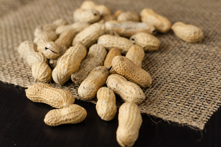 Peanuts in shell on jute tablecloth