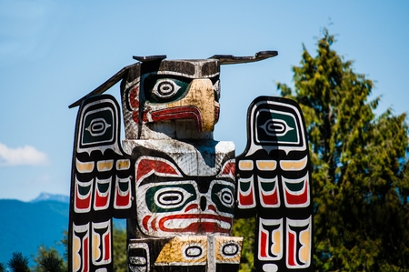 Eagle totem pole close up in New Westminster park, Vancouver, Canada, close up