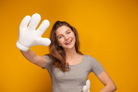 Funny girl dressed plush hand for fun.の写真素材