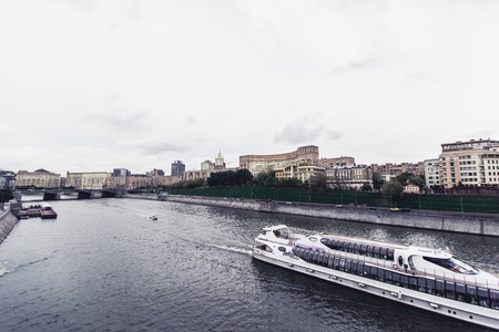 Russia, Moscow, october 13, 2017: Cityscape of the city. Summer season. Editorial image. Retro style image with glare of lightのeditorial素材