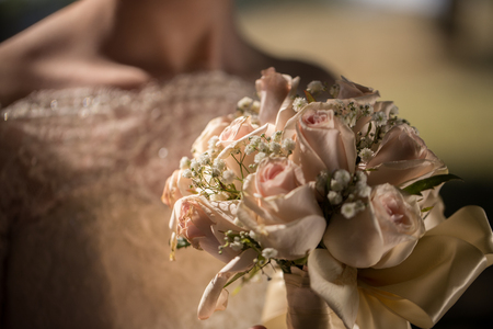 Big nice wedding bouquet in womans hands. Bride on her wedding ceremony.の写真素材