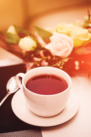 Cup of tea on the table. Breakfast time. Food photo with flare.の写真素材