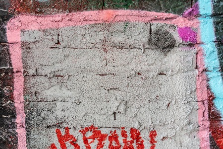 A wall with graffiti of unknown artists. Street art. Copyspace for text and design.