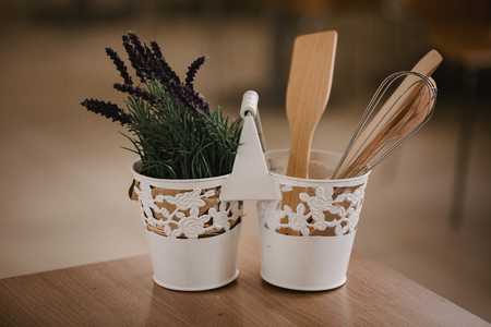 Kitchen accessories in the style of Provence. Devices for cooking from natural wood. Lavender in a pot. Background for food concept design or interior design.の写真素材