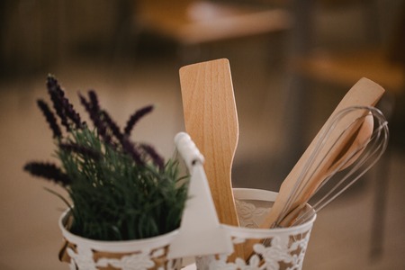 Kitchen accessories in the style of Provence. Devices for cooking from natural wood. Lavender in a pot. Background for food concept design or interior design.の写真素材