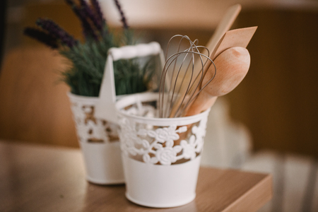 Kitchen accessories in the style of Provence. Devices for cooking from natural wood. Lavender in a pot. Background for food concept design or interior design.の写真素材