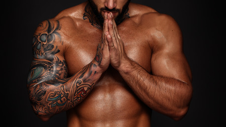 Bodybuilder image with muscle man torso. Banner image of sexy  with muscular body. Portrait of sexy male model. Hot macho in abs poses on black . 16 in 9 crop for design.の写真素材