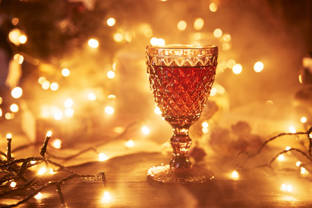 Festive atmosphere in the evening with a glass of red wine. Smoke creeping into clubs and light...