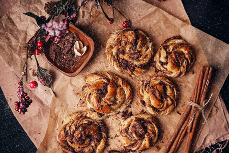 Buns with chocolate and cinnamon as cake food concept. Top view.の写真素材