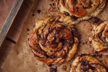 Buns with chocolate and cinnamon as cake food concept. Top view. Close up image.の写真素材