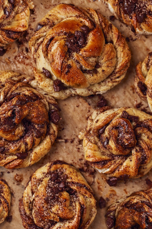 Buns with chocolate and cinnamon as cake food concept. Top view. Close up image.の写真素材