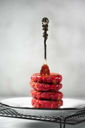 Pyramid of heesecakes with honey - russian traditional breakfast. Food consept. Plate with cakes on white marble background, Copyspace for text and design elements.の写真素材