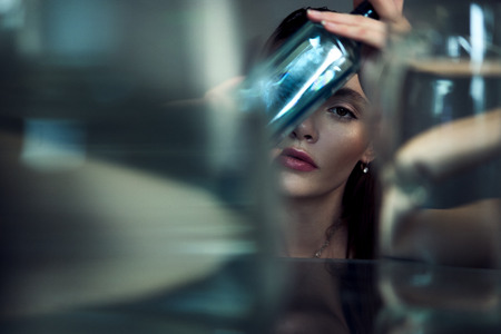 Beauty portrait of girl with water and reflections. Hight quality retouching photo. Fashion model.の写真素材