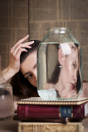 Beauty portrait of girl with water and reflections. Hight quality retouching photo. Fashion model.の写真素材