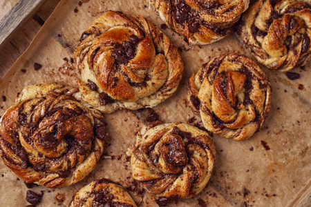 Buns with chocolate and cinnamon as cake food concept. Top view. Close up image.の写真素材