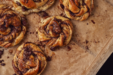 Buns with chocolate and cinnamon as cake food concept. Top view. Close up image.の写真素材