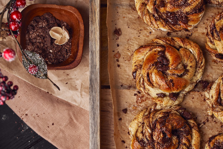 Buns with chocolate and cinnamon as cake food concept. Top view. Close up image.の写真素材