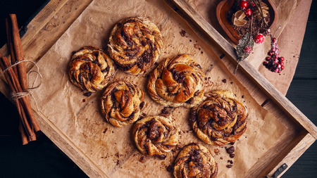 Buns with chocolate and cinnamon as cake food concept. Top view.の写真素材