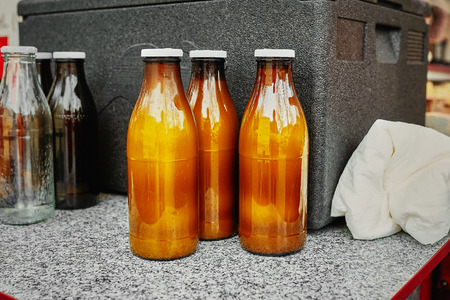 Natural goat's milk in kraft brown bottle at a farmers market. Useful and healthy food.の写真素材