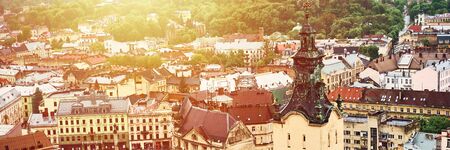Lviv, Ukraine - May 20, 2019: View of the old Lviv. Bright color roofs of houses in historical city center. Banner crop 3 in 1.のeditorial素材